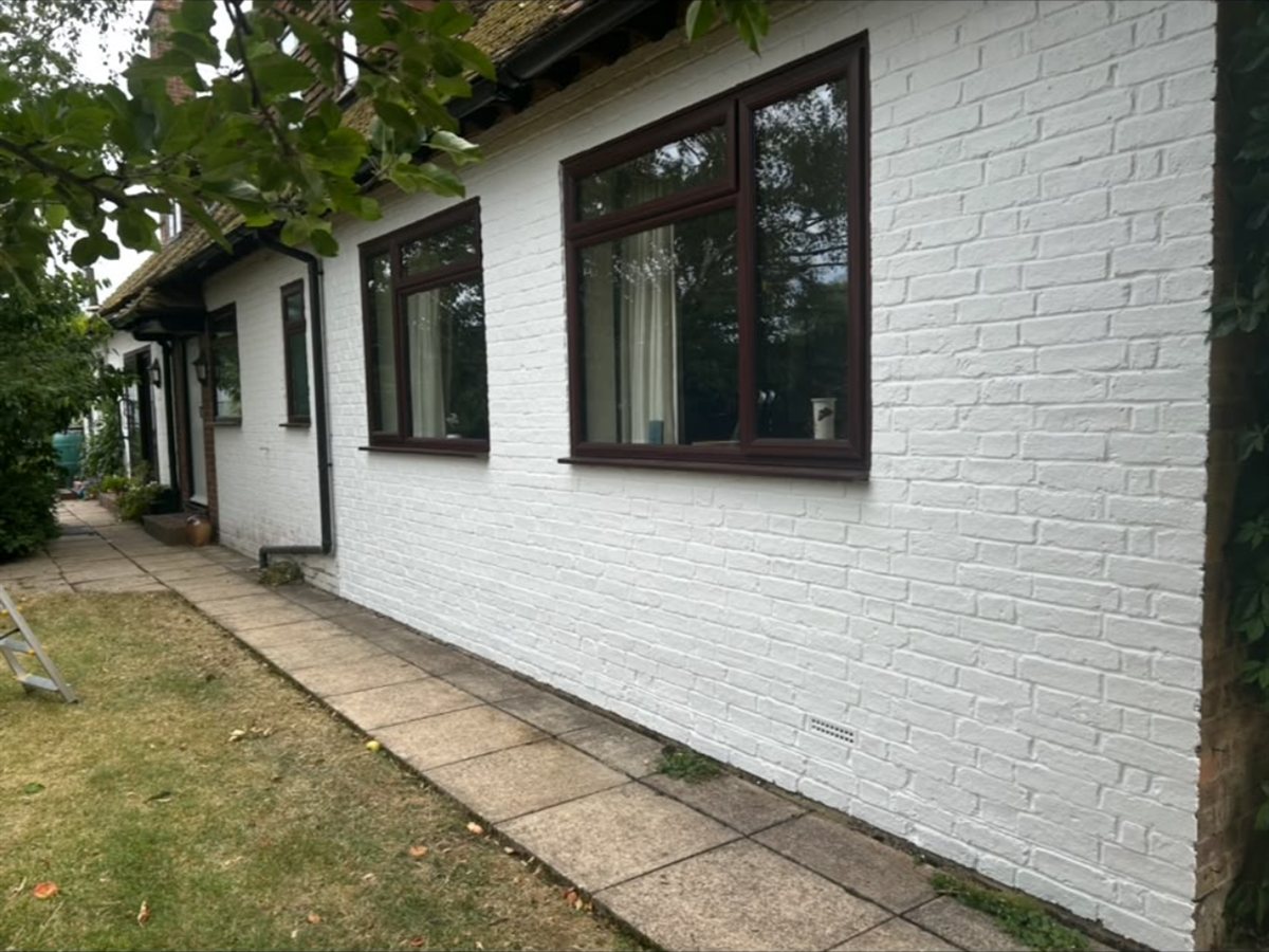 After, Painted brick elevation cleaned up and repainted crisp white
