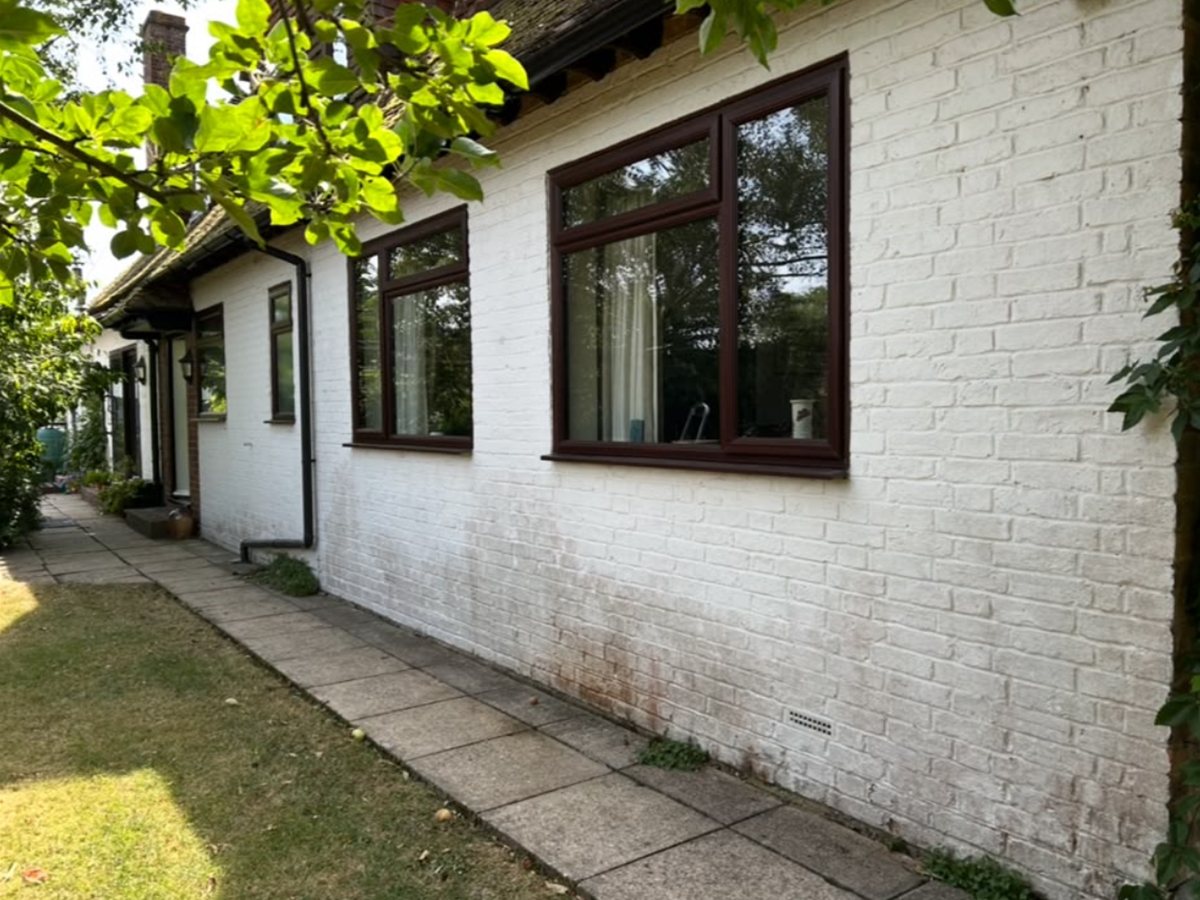 Before, Painted brick elevation cleaned up and repainted crisp white