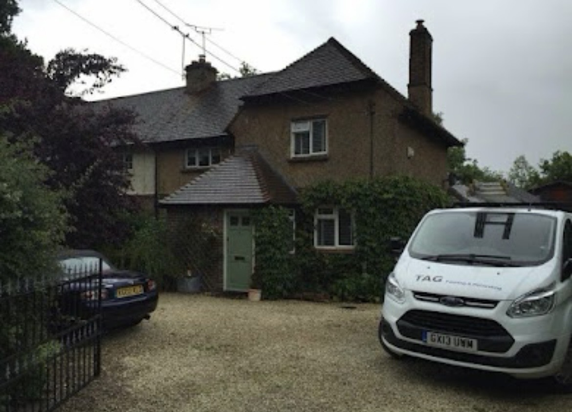 Before, Pebbledash cottage repainted brilliant white